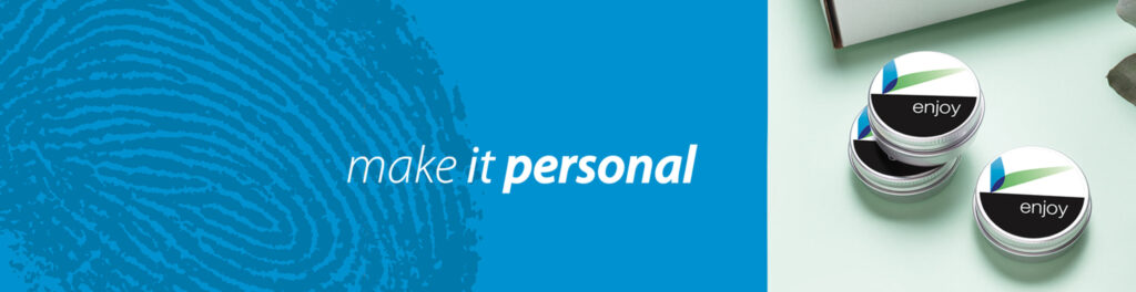 Make it personal branding message with a blue fingerprint texture and promotional tins featuring the company logo.